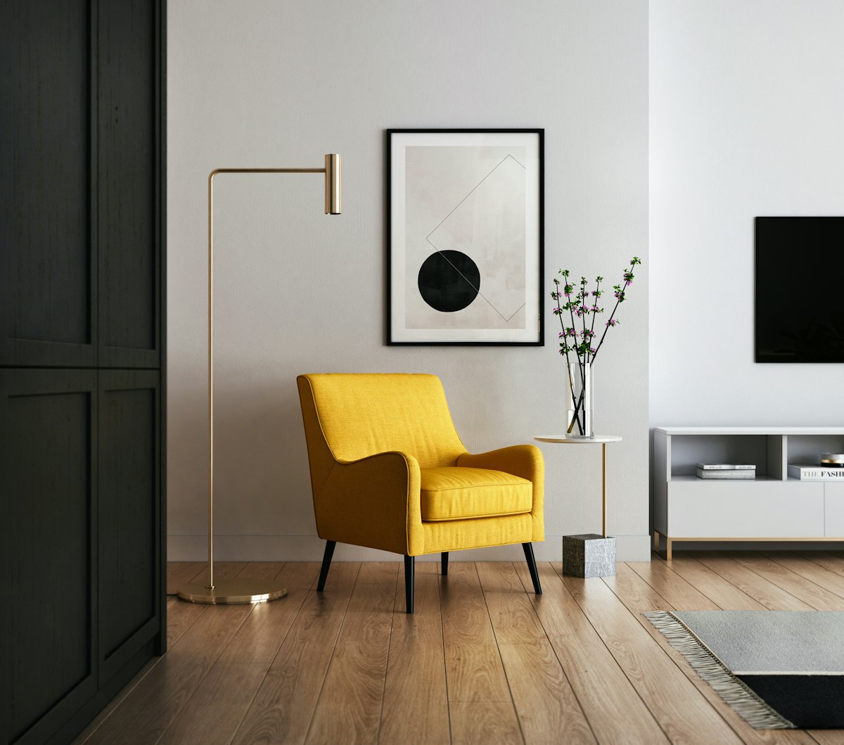 A compact, airy living room with low-profile cream sofa, round travertine coffee table, and natural sunlight